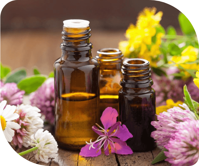 Close up image of a medicine bottle with flowers in background